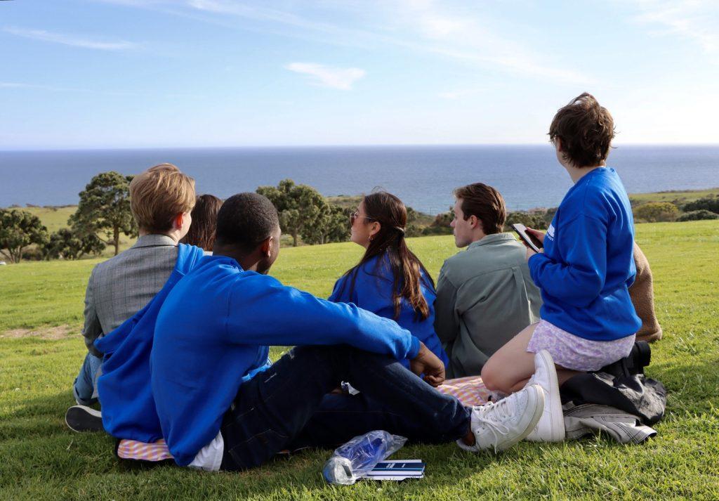 Seniors look out at the view on Alumni Park at Senior Sunset on April 7. Students enjoyed free merch, food and music.