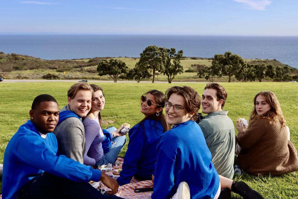 Seniors smile at Senior Sunset on Alumni Park on April 7. Students said the event was a great time to spend with friends and watch a Malibu sunset.