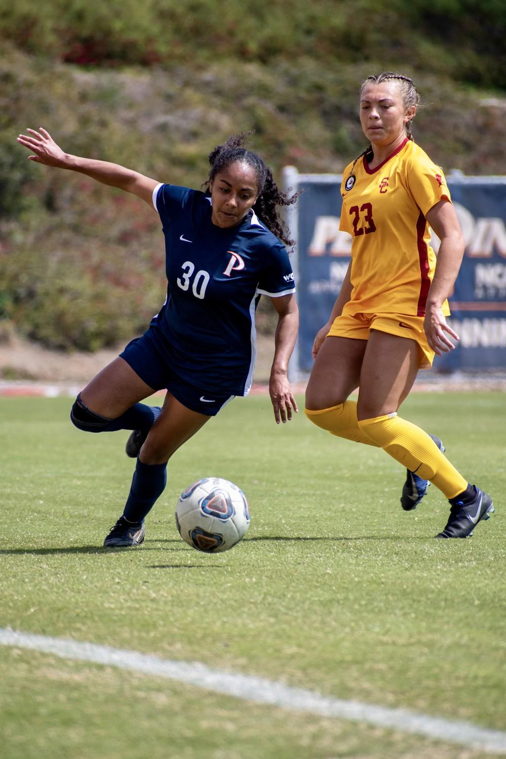 Redshirt Sophomore Defender Kam Pickett chases down the ball Sunday, April 2, at Tari Frahm Rokus Field. Throughout the match, Pickett flew up and down the field, putting constant pressure on USC's midfield. Photo by Colton Rubsamen