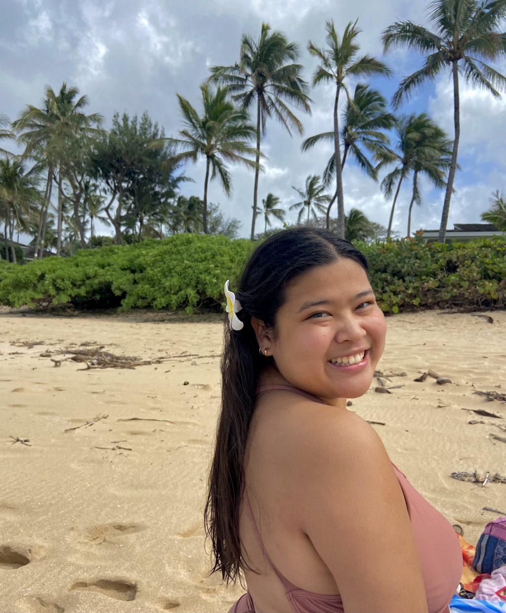 Kiaaina poses on Hale'iwa Beach in O'ahu on March 1. She said her favorite place on the island is the North Shore. Photo courtesy of Kala'i Kiaaina
