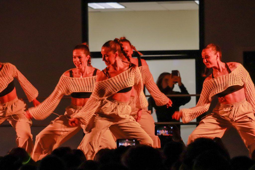 Members of Delta Gamma smile while in the middle of their dance number during PUTYCD on March 31 in the Caf. Students cheered loudly as each group performed.