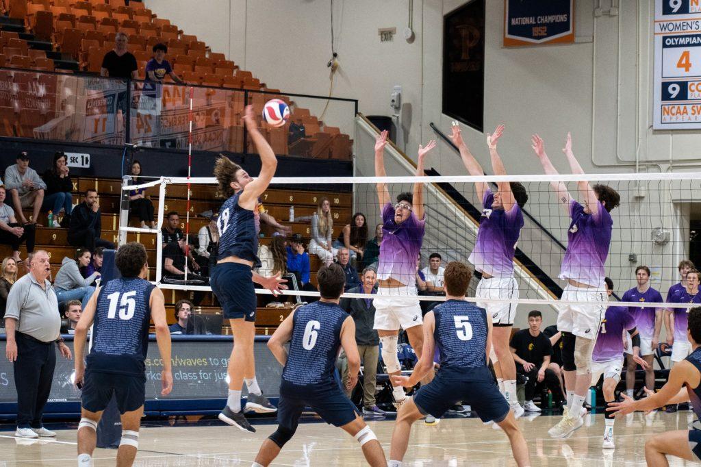 Redshirt junior opposite Jacob Steele makes a volley which is blocked by a Cal Lutheran wall at Firestone Fieldhouse on April 1. The Waves faced some resistance during the third set.