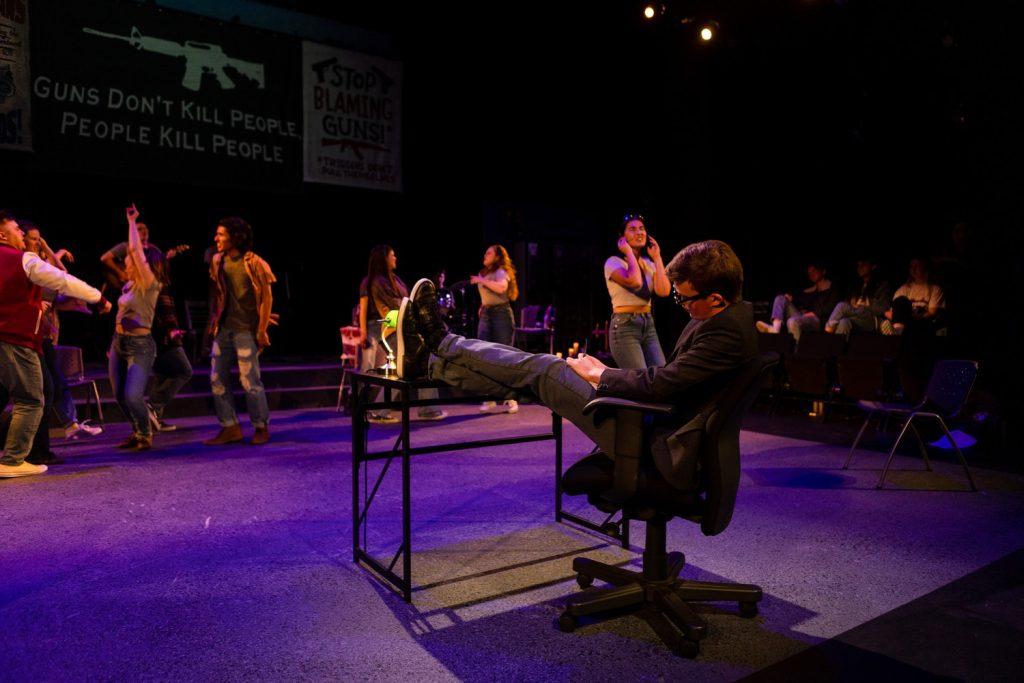 The cast and crew sing a ballad on stage at Smothers Theatre on April 3. Several banners were displayed throughout the play with important messages bringing awareness to the issue of gun violence.