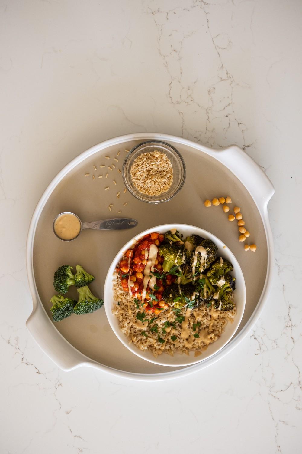 One can customize the "Bowling for Rice" Veggie and Grain Bowl to fit their food needs and likes, such as swapping brown rice for quinoa or broccoli for sweet potato. This meal contains ingredients with protein and carbohydrates as well as produce grown at local farms.