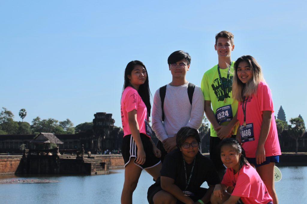 Sin and her friends smile after finishing their annual 10k run at Angkor Wat in December 2018. Sin said this was a tradition she and her high school running club friends took part in every December. Photo courtesy of Merica Sin