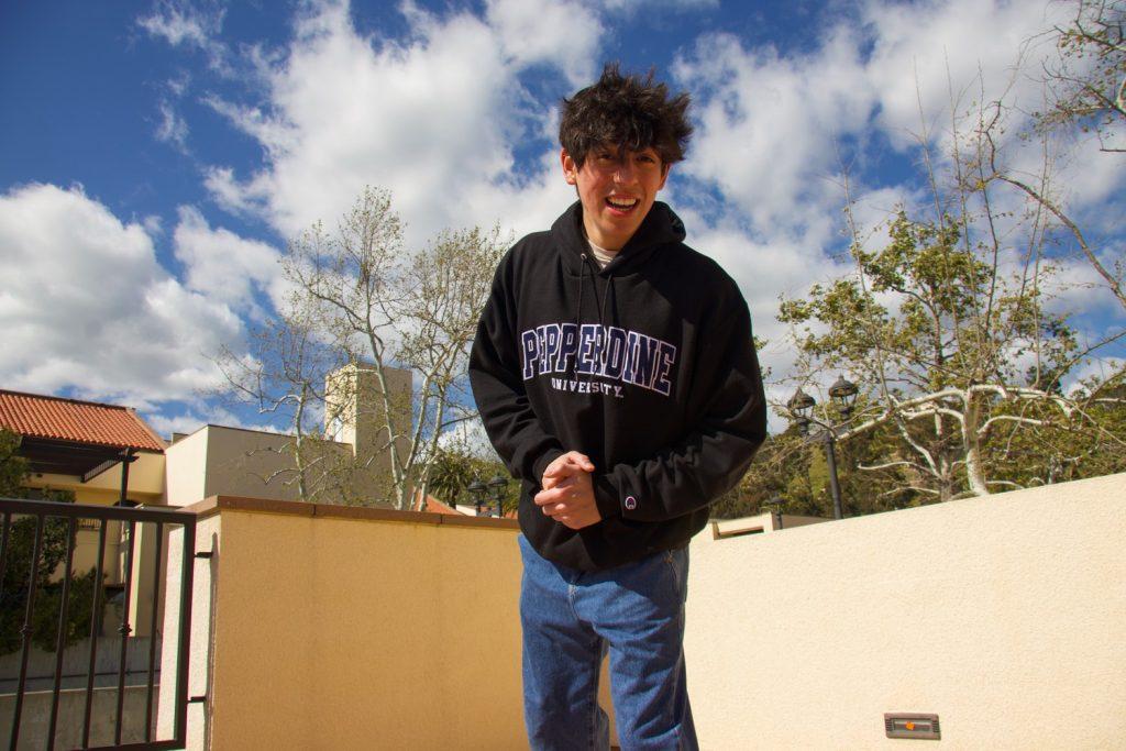 First-year Zachary Garcia stands outside the Lighthouse on April 4. Garcia said he hopes to support other first-generation students and share his experiences with them. Photo by Emma Ibarra