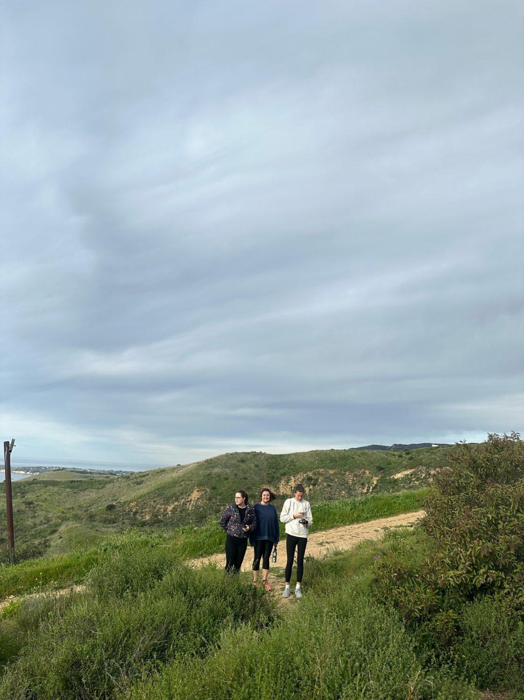Hawkins (left), former Creative Director Haley Hoidal ('23) (right) and I (middle) hiking through Malibu in February. We decided to hike on a whim, but the pictures from that day were absolutely beautiful.