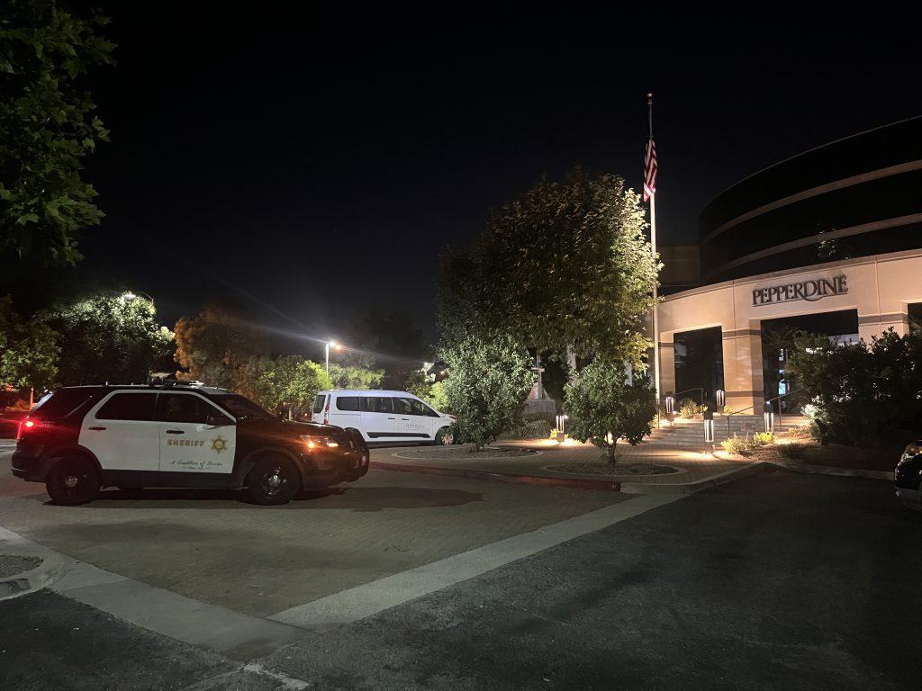 A Lost Hills Sheriff’s deputy SUV sits outside of Pepperdine's Calabasas campus Wednesday night. The L.A. County Sherriff's Department sent deputies to the scene to confirm there was no danger.