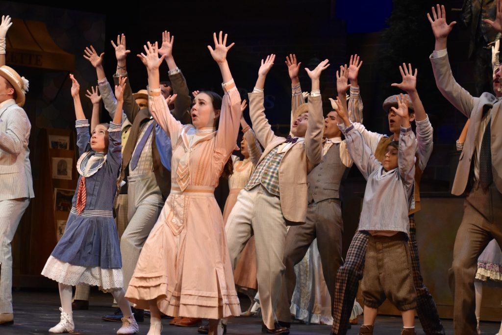 The cast dance and sing during the many large musical numbers in "The Music Man." The show is directed by Kelly Todd and features many faculty children in the cast.