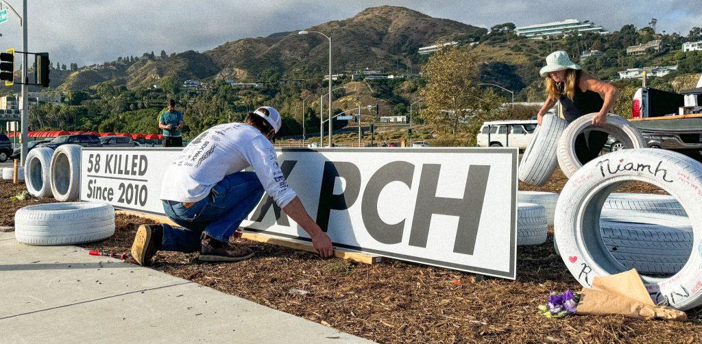 Volunteers from Fix PCH work to build the ghost tire memorial Nov. 18. Since 2010, 58 people have died on PCH in Malibu, said Damian Kevitt, executive director and founder of Streets Are For Everyone. Photos by Millie Auchard