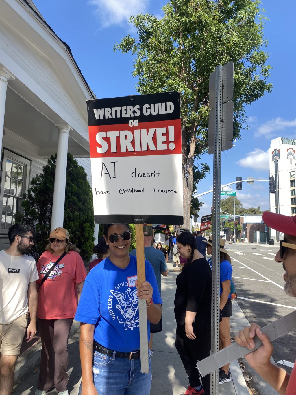 A member of the Writers Guild of America striking at a protest. Photo by Samantha Torre