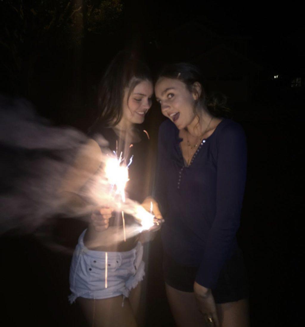 Niamh and Harkness pose with a firework.