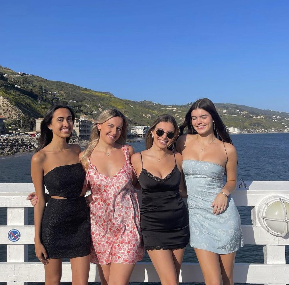 Asha, Peyton, Thompson and Niamh pose together at the Malibu Pier before an Alpha Phi formal.