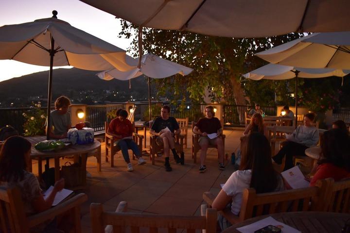 Students in the Landed program meet on the Lighthouse Patio to discuss their transition. The Landed program meets every Tuesday from 6-7 p.m. Photo by Mary Elisabeth