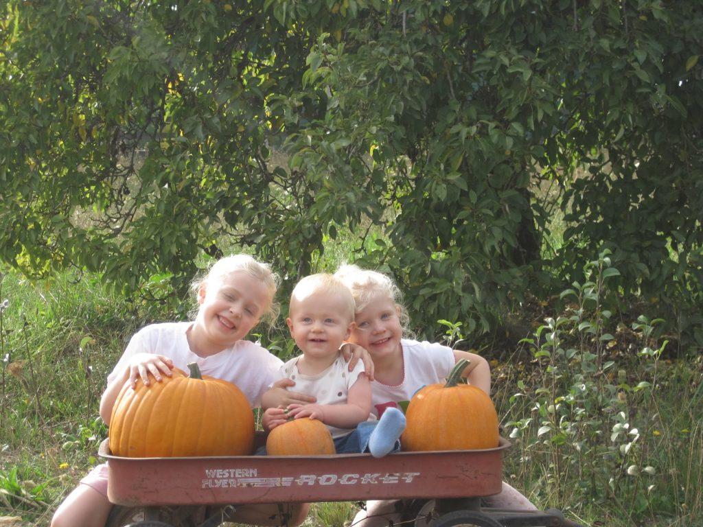 First-year Abby Rader sits with her siblings and the pumpkins her Oma — her grandma — picked out for them in October 2010. Rader said these memories make fall a nostalgic season for her. Photo courtesy of Abby Rader