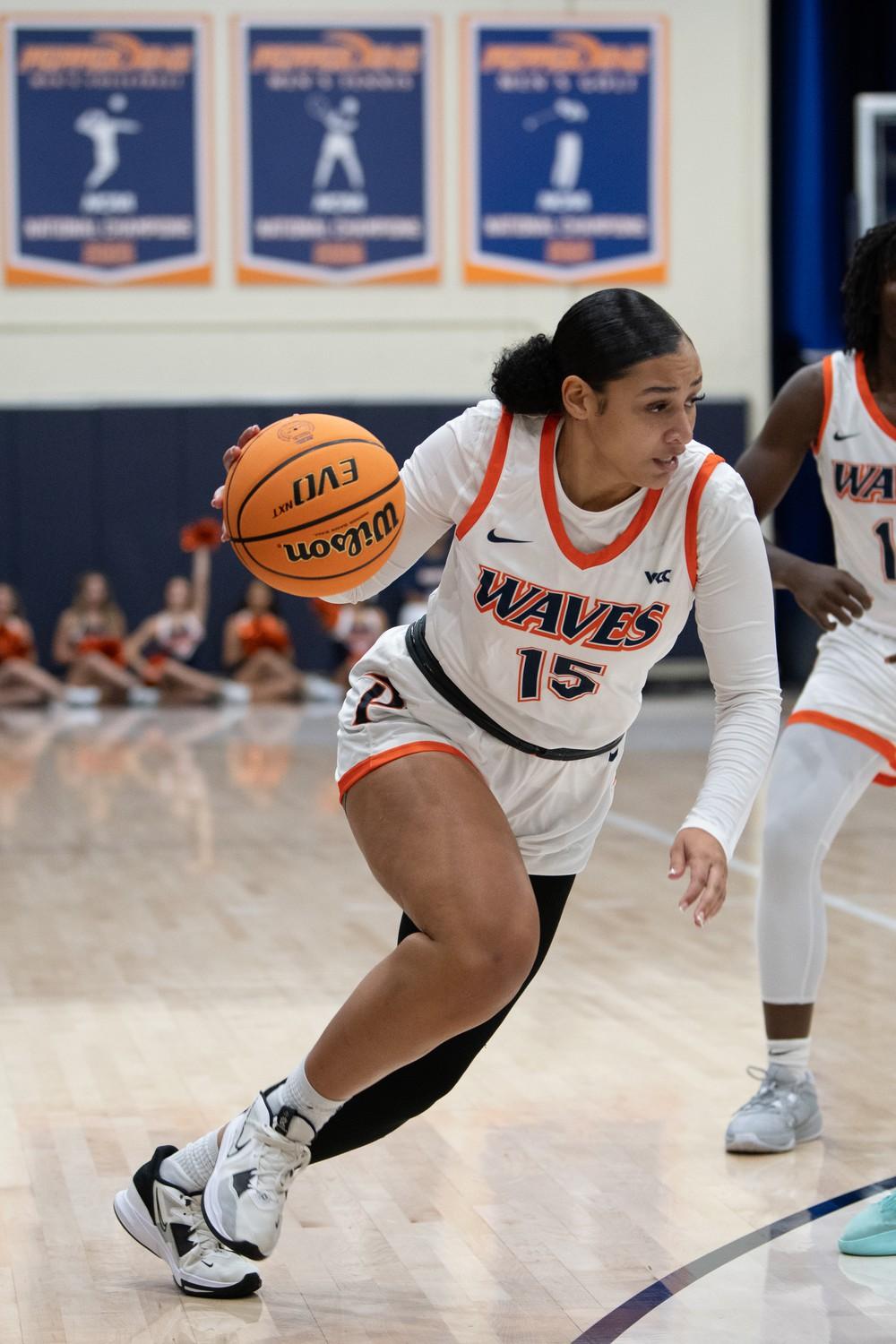 Graduate student guard Myra Gordon building up to drive toward the net against UC Irvine on Nov. 7 at Firestone Fieldhouse. Gordon not only led the team in points, but she also led the team in steals with five.