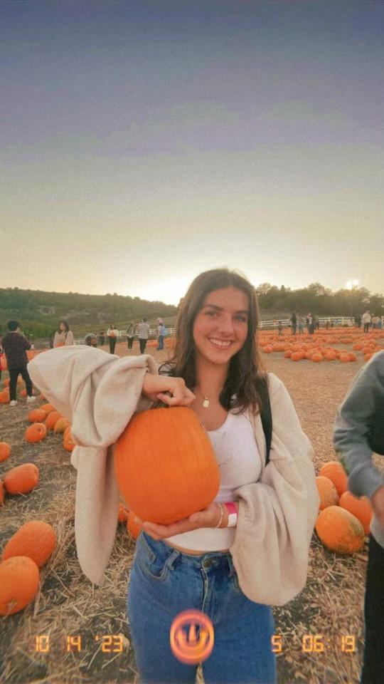 Coady holds a pumpkin she found at the Cal Poly Pomona pumpkin patch. Coady said she and her friends visited the pumpkin patch on her way back from Big Bear over fall break. Photo courtesy of Kristin Coady