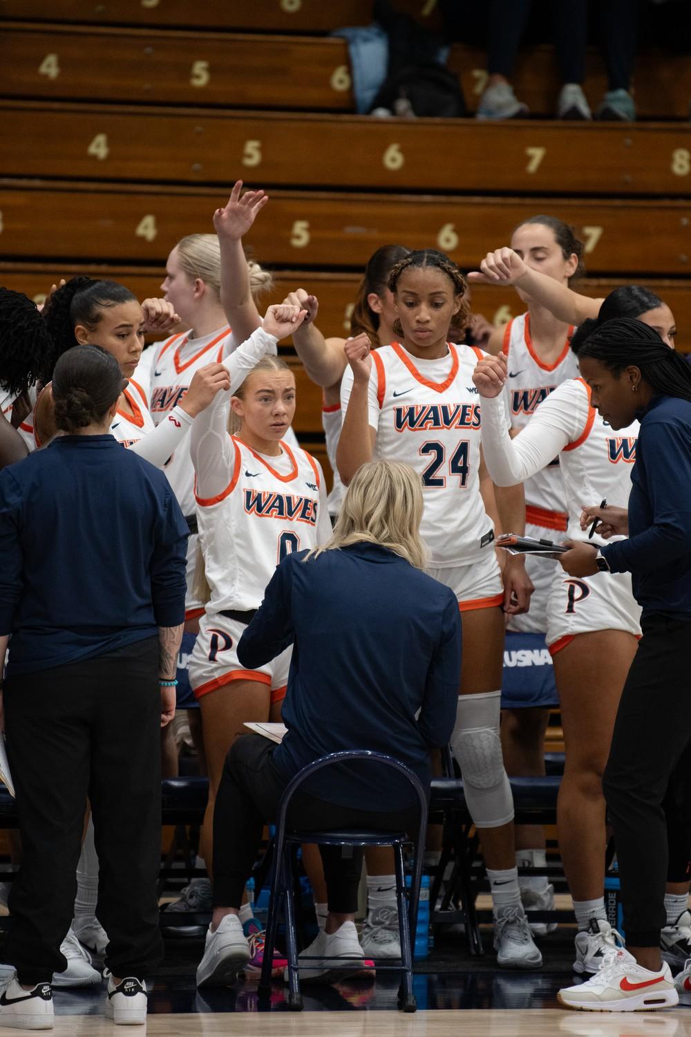 Pepperdine gets ready to break out of a timeout. The Waves utilized all their timeouts this match saving two timeouts for the fourth quarter, and used both during the last 30 seconds of regulation. Photo courtesy of Alexander Li