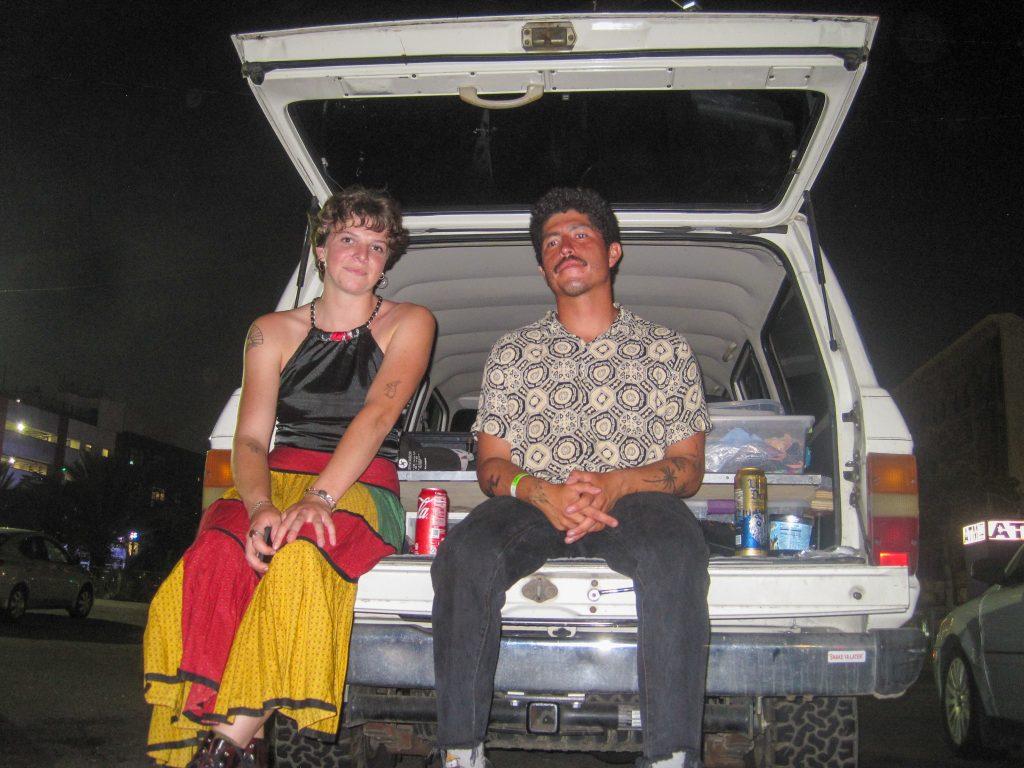 Millie's friends Brooke Carlson and Jafet Arango sit on the tailgate of her car July 30. Millie's car was at the mechanic for over a month. Photo by Millie Auchard