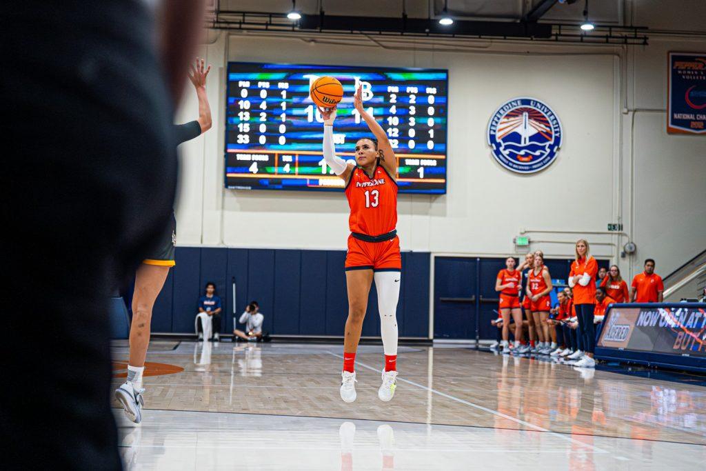 Junior guard and forward, Emerita Mashaire, looks to drain a three-point shot for Pepperdine against Long Beach State on Nov. 27 in Firestone Fieldhouse. Mashaire collected six points for the Waves.