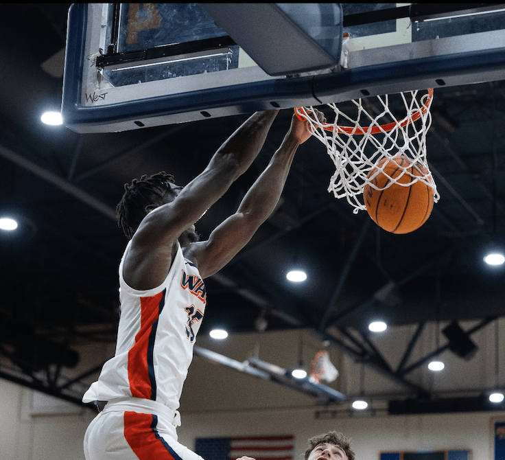 Aladji Gassama, redshirt sophomore and Mali native, scores a slam dunk for the Pepperdine Waves in Firestone Fieldhouse on Nov. 6. Gassama's favorite memory was beating Portland in double overtime Feb. 4. Photo courtesy of Aladji Gassama