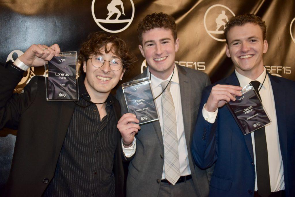 Lorenzo Mars (left) holds up his VIP pass with other VIPs Casey Cook (middle) and Jacob Melton (lright) on the red carpet Feb. 9. Mars said he could not wait for the audience to see the film and hoped it would make them laugh.