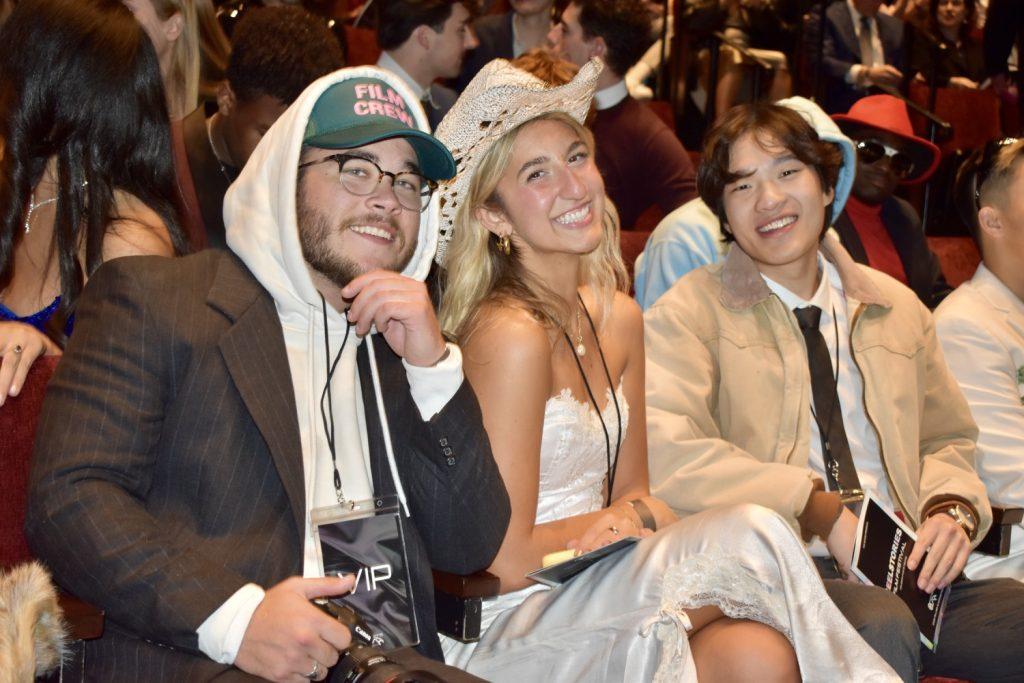Sophie Kairis (middle) poses for a photo with her crewmates Matthew Dylan (left) and Kevin Zhang (right) during the awards ceremony Feb. 9, in Elkins Auditorium. Kairis was the director, writer, cinematographer and editor of "When a Fire Starts to Burn," which took home two awards that night.