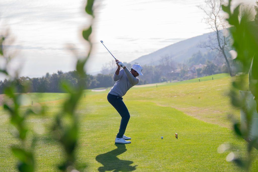 Sophomore Mahanth Chirravuri drives toward the green at the Southwest Invitational in Westlake Village, Calif., on Jan. 31. Chirravuri finished tied for sixth in individual play at the Southwest Invitational. Photos courtesy of Pepperdine Athletics