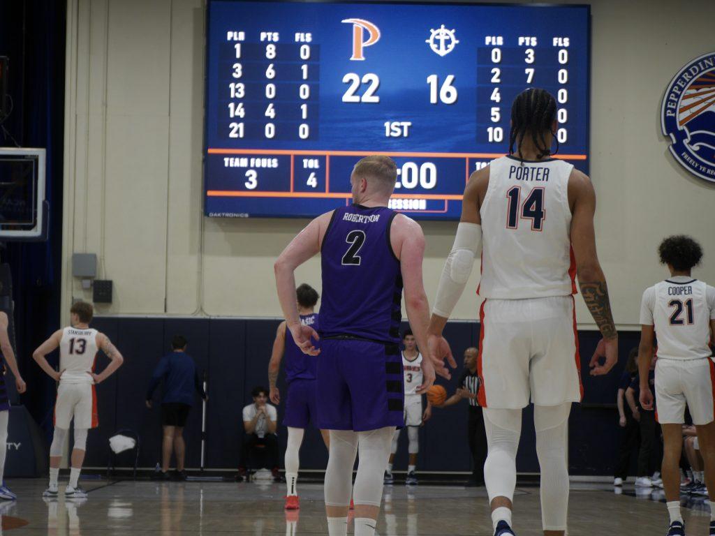 Pepperdine Men's basketball team takes a breather after a foul in the first half Feb. 17, at Firestone Fieldhouse. Pepperdine ended the half in the lead with a score of 52 to 36. Photos by Sharon Stevens