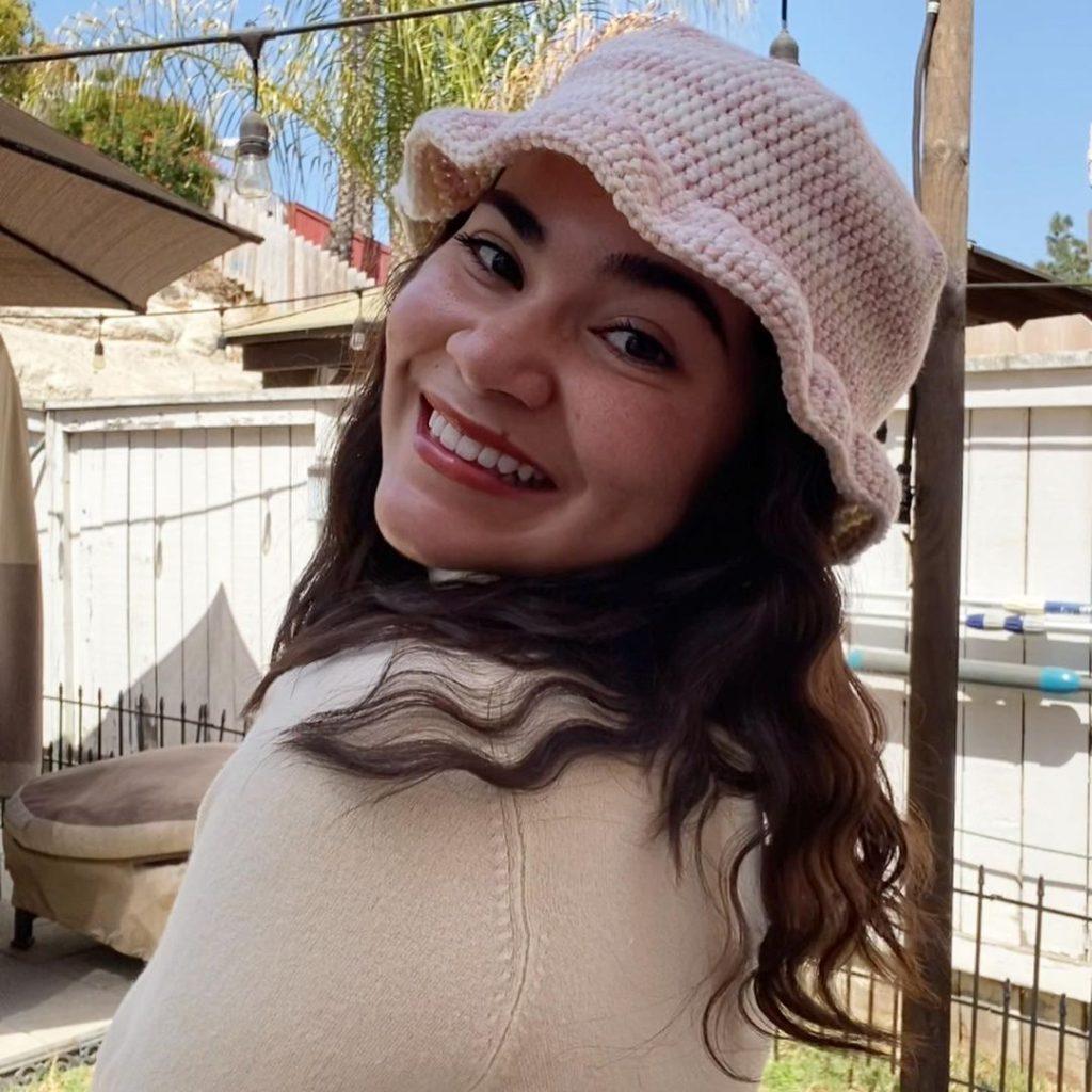 Natalee Borum wears one of her crochet bucket hats, posted on @crochets_by_nat April 12, 2021. Borum said she activates her crochet shop every summer when she is back home to sell her work and take on commissions. Photo courtesy of Natalee Borum