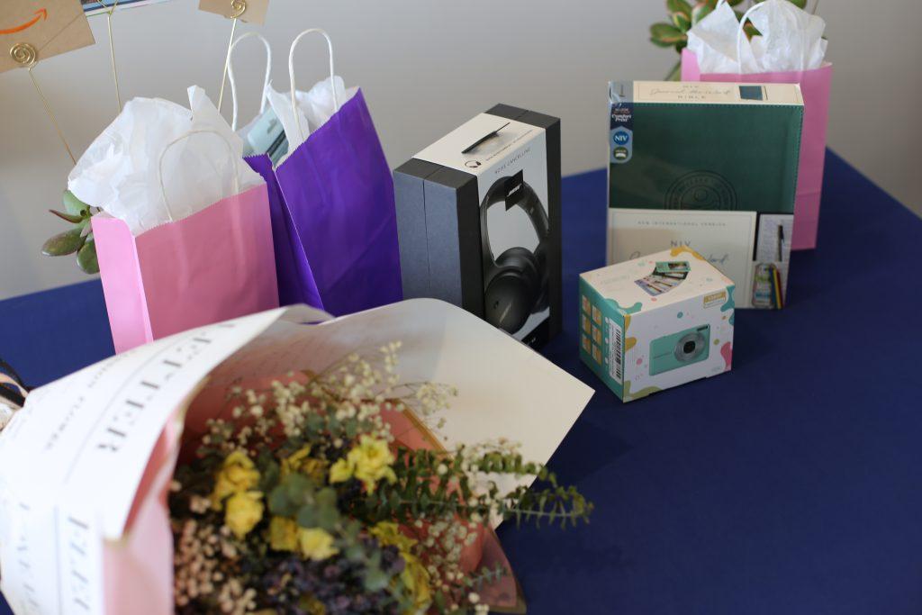 A digital camera, headphones, a guided Bible and other prizes sit ready to be given away to attendees during the dinner session in the Light House on Feb. 26. Keynote speaker Dr. Deanna Thompson led the dinner session. Photo courtesy of Tim Horton