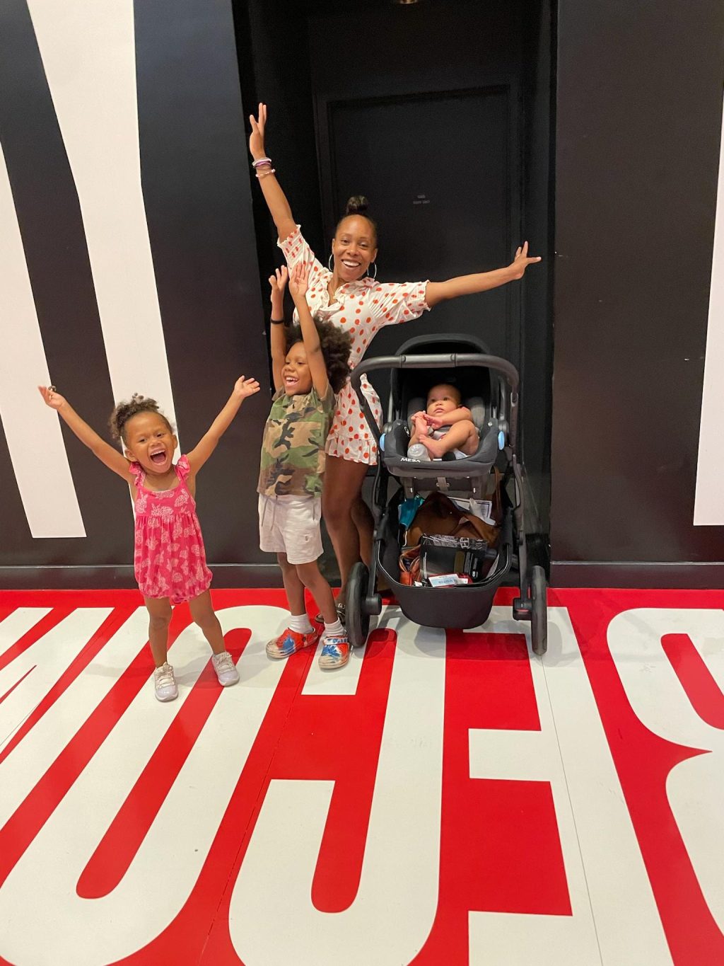 Ali Holness-Roland smiles with her three kids at the Hirshhorn Museum in Washington, D.C. July 2, 2022. Roland found art as resistance in teaching her children their inner greatness, she said. Photo courtesy of Ali Holness-Roland