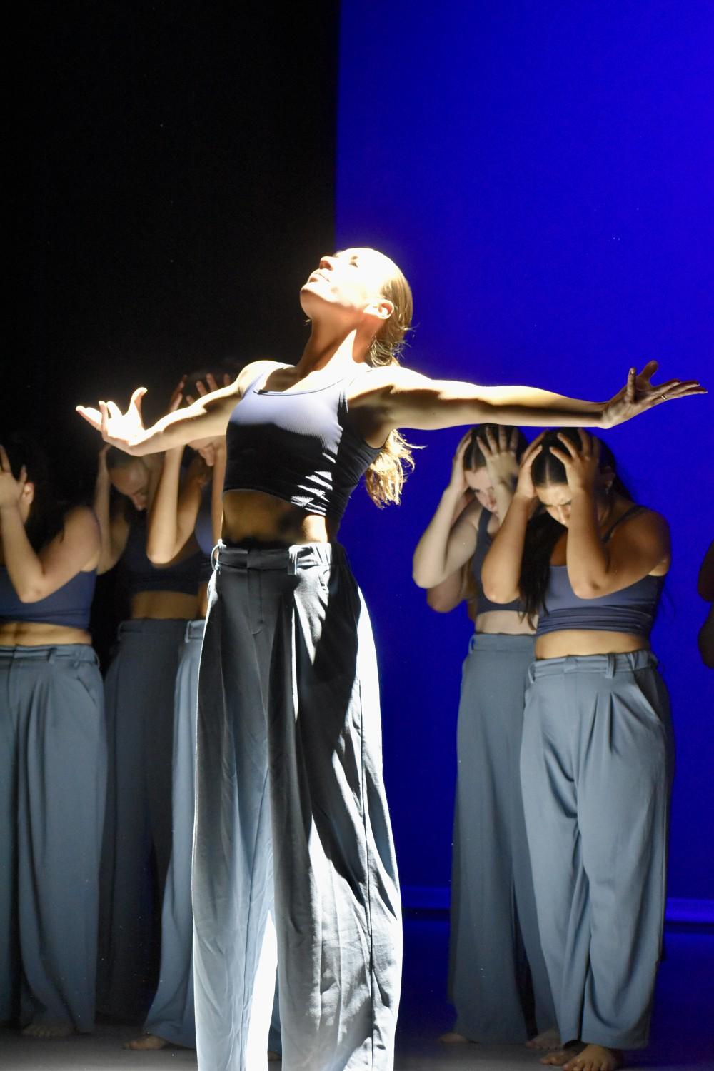 Dancer Belle Mason closed out the opening routine with a powerful stance in the middle of the stage. The theme "Wonder" represented the deepness of thoughts and the power in breaking free from thoughts, students said. Photo courtesy of Mary Elisabeth