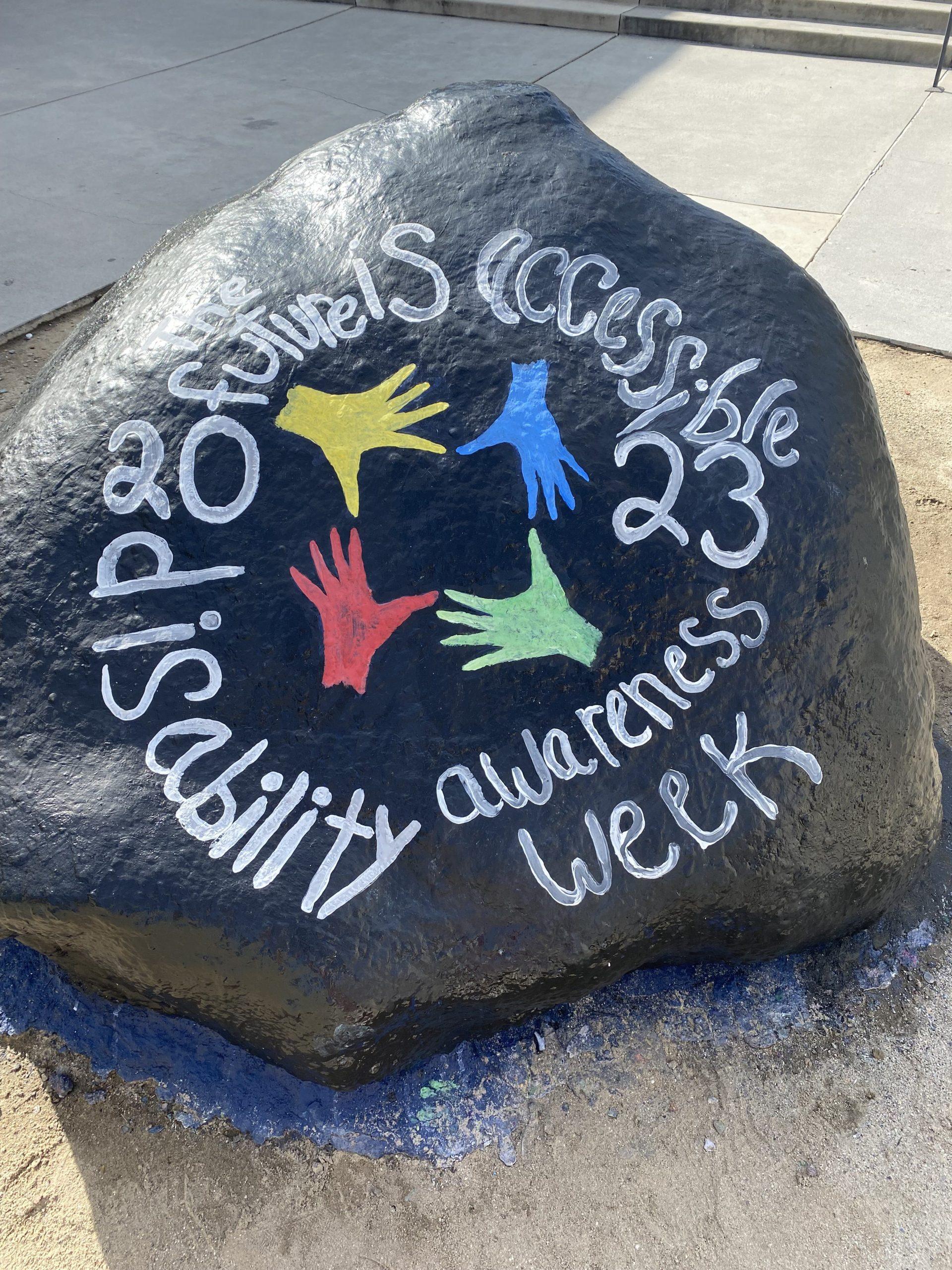 This year, the committee tabled the whole week of March 11 at Mullin Town Square. In 2023, the organizing committee painted the rock on main campus. Photo courtesy of Maddie Beadle