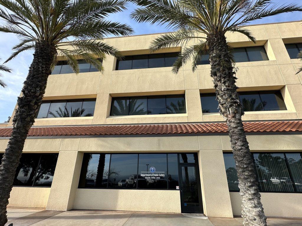Two palm trees sway in front of the Department of Public Safety on March 12. The DPS office overlooked the Pacific Ocean. Photo by Victoria La Ferla