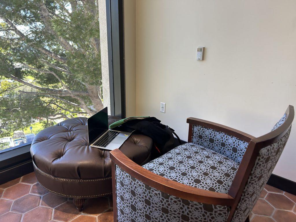 A laptop rests on a brown ottoman in Payson Library on Feb. 21. The Apple computer was left unattended. Photo by Yamillah Hurtado