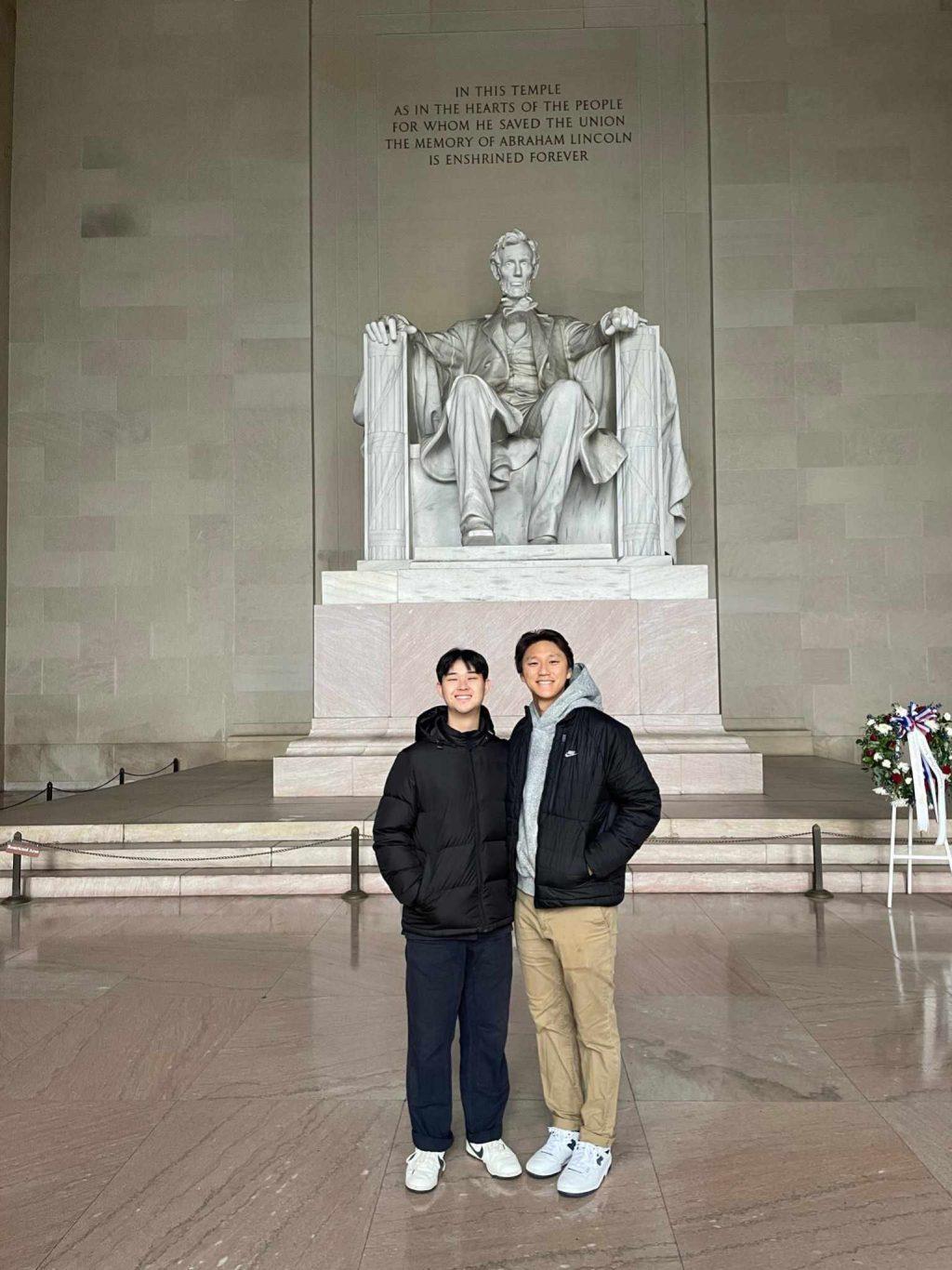 Juniors Dylan Chai and Issac Kim pose in front of the Lincoln Memorial on Feb. 27. They explored the city and visited historical sites in their free time, Chai said. Photo courtesy of Dylan Chai