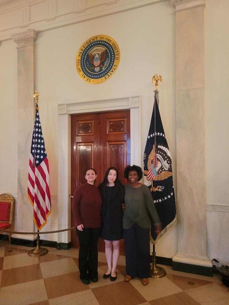 From left, first-year Lukka Belyavskiy, junior Sophia Luo, Life & Arts staff writer, and senior Jackie Ferrari pose for a photo in the White House on Feb. 27. Students walked through the East Room, Green Room, Blue Room, Red Room, State Dining Room and Old Family Dining Room during the tour. Photo courtesy of Jackie Ferrari