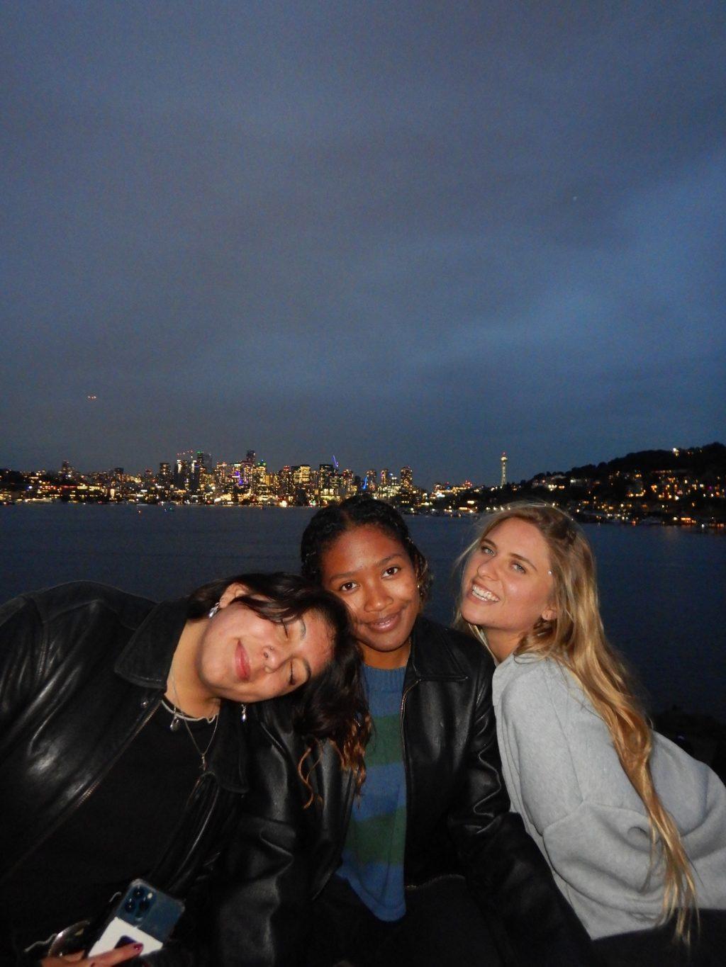 (From left to right) Carly Rodriguez, senior Sydney Jean-Simon and senior Annika Huckeba pose in front of a city view of Seattle in October 2023. Huckeba said she is most grateful for the friendships she has made throughout college. Photo courtesy of Annika Huckeba