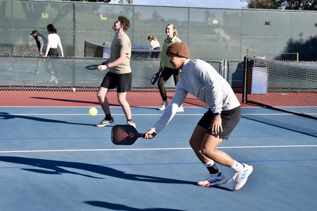 Pepp Pickle members have fun playing doubles during an open play session Feb. 10, at Lower Alumni Courts. Pepp Pickle members pair up in doubles or play in singles during sessions, Lorimer said. Photo by Mary Elisabeth