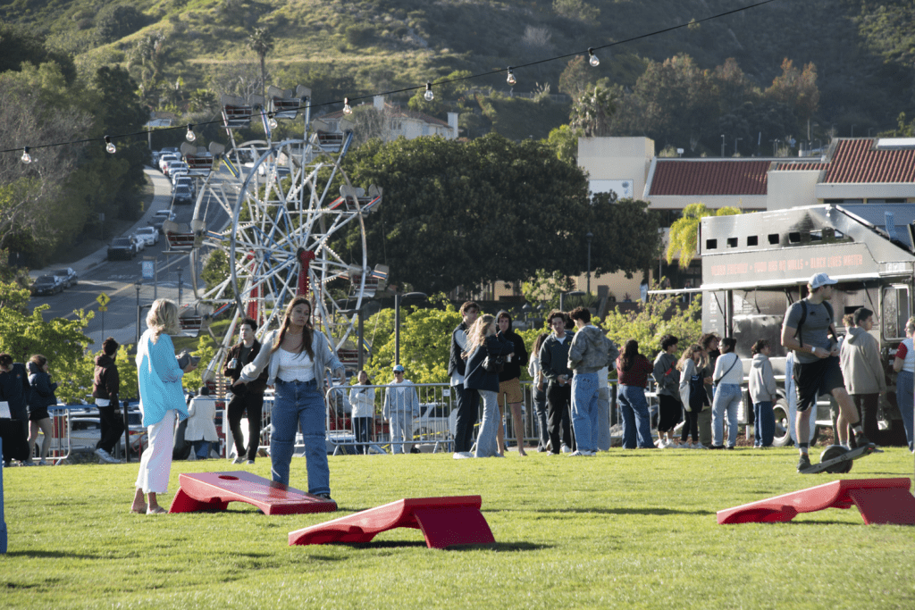 A Ferris wheel, food trucks and cornhole games entertain the Pepperdine community March 23, at Alumni Park. Students enjoyed these activities until the end of the night.