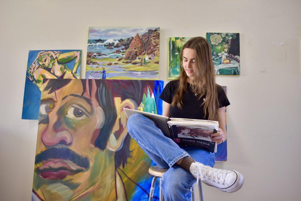 Junior Eden Reitnour draws in her sketchbook in the CAC. Reitnour said she enjoys various media of art and loves the creative process. Photos by Mary Elisabeth.