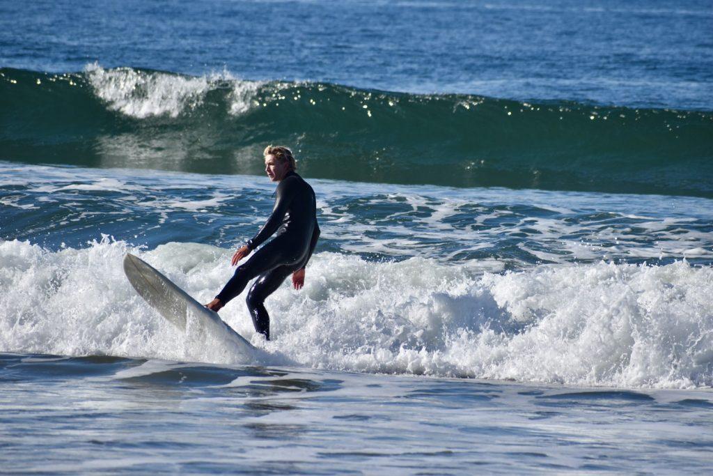 Joe Rickabaugh, Pepperdine's club surf team coach, shreds at Zuma Beach on March 28. Rickabaugh said surfing has been a constant throughout his life. Photo by Mary Elisabeth