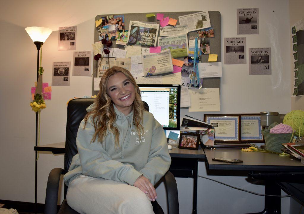 Executive Editor Abby Wilt sits in her office in the PGM newsroom April 9. She has found good news in her work as a student journalist. Photo by Mary Elisabeth