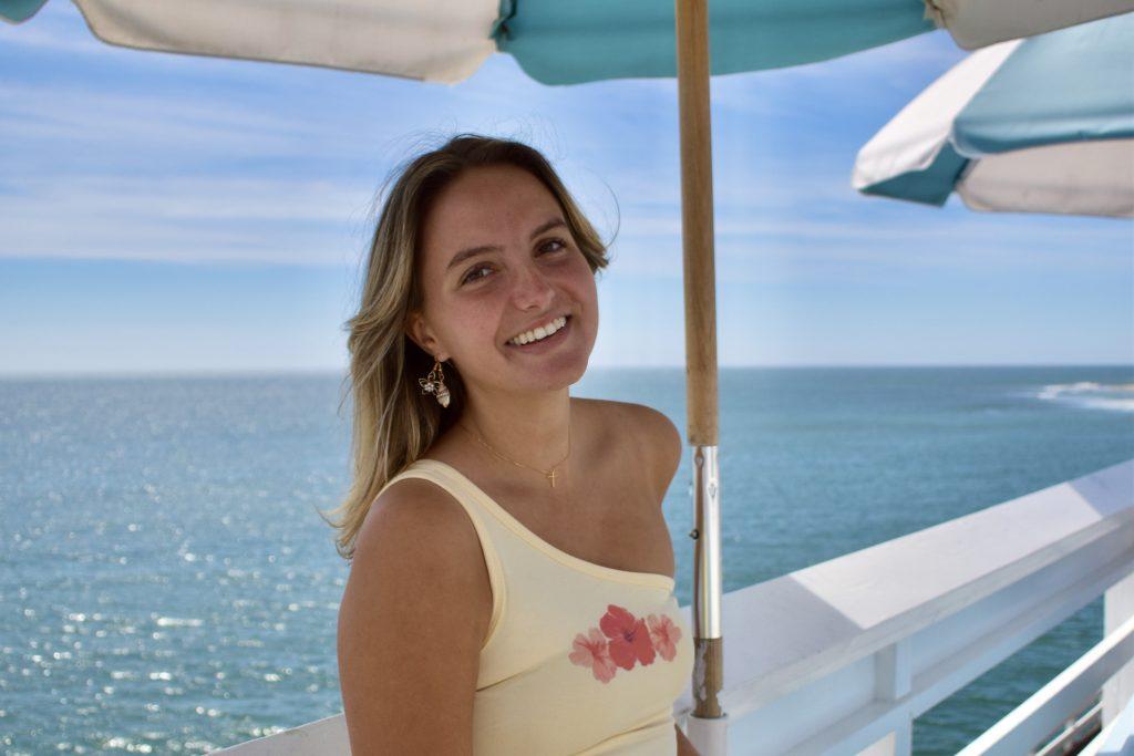 Junior Olivia Formato smiles on the Malibu Pier. Formato said her first true impression of Malibu occurred when she toured Pepperdine in 2018. Photo by Mary Elisabeth