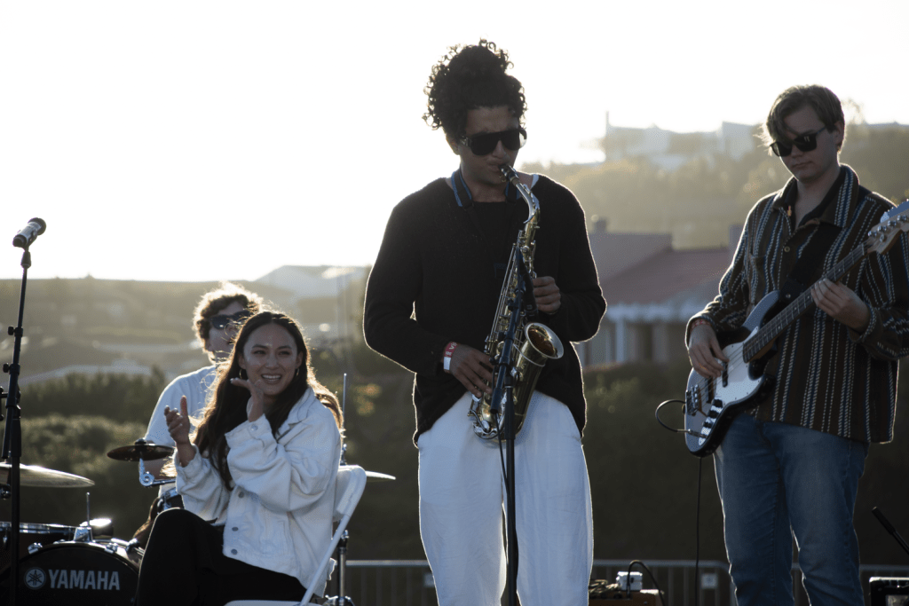 Freshman Amir Paridari plays the saxophone for the student band Press Play Septet March 23, at Alumni Park. The band played both jazz instrumental and lyrical songs.