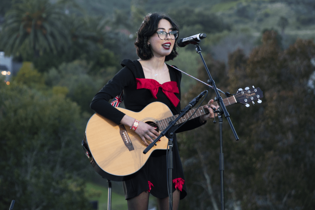 Senior Beth Gonzales, Life & Arts senior reporter, plays both original songs and covers March 23, at Alumni Park. She said she hopes to continue her music for her future goals.