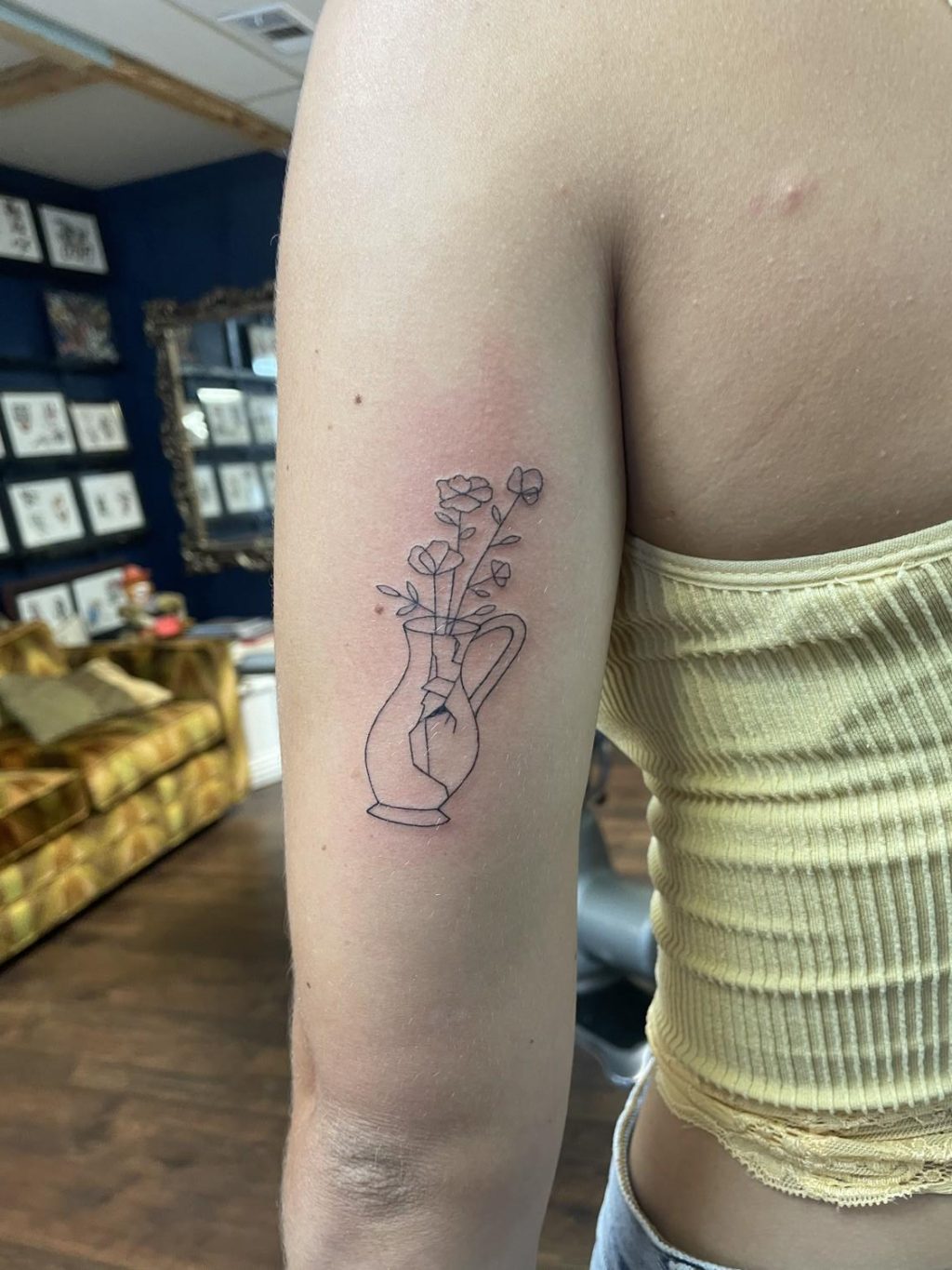 Senior Isabella Joiner's tattoo of a cracked vase holding flowers sits on the back of her left arm Aug. 5, in Fort Walton, Florida. Joiner said this was her first tattoo, and she had been wanting one since she was 18. Photo courtesy of Isabella Joiner