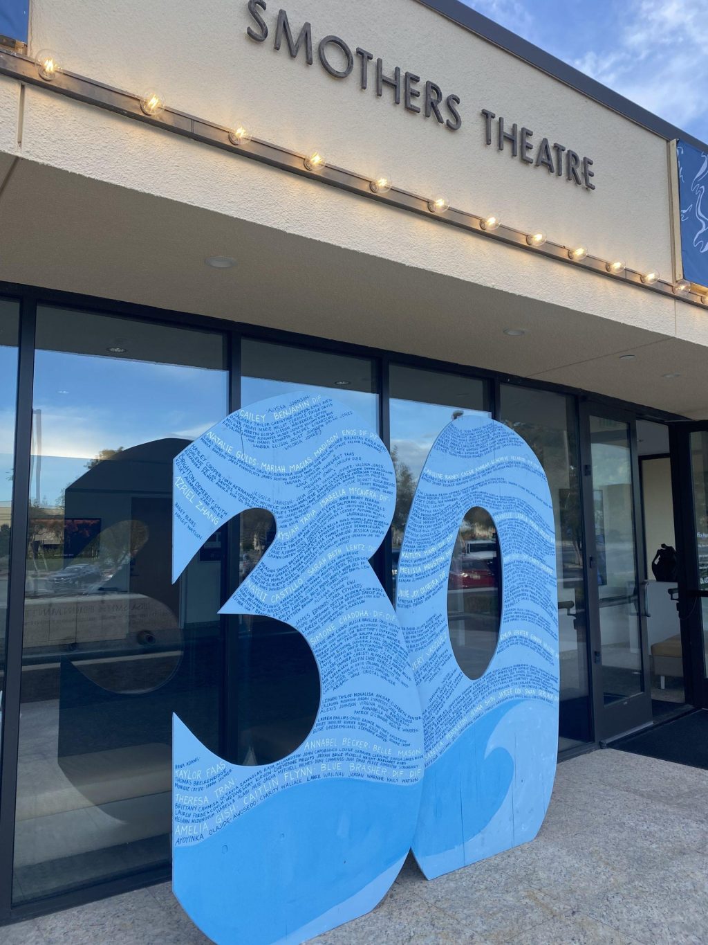 Alumni come together to watch the afternoon showing of the 2024 DIF show in Smothers Theatre on March 19. Price said they constructed a decorative sculpture of the number 30, which displayed the name of every DIF member since the first show in 1994 and stood in front of Smothers during show week.