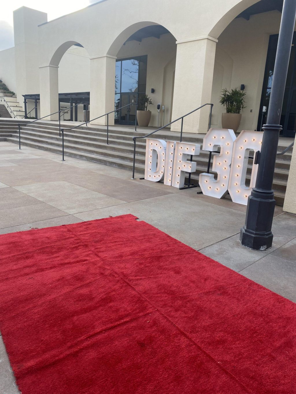 Alumni celebrate the DIF 30th anniversary by gathering on a red carpet at Lower Mullins, before watching the DIF film March 16. The company produced the film in 2013, Price said.